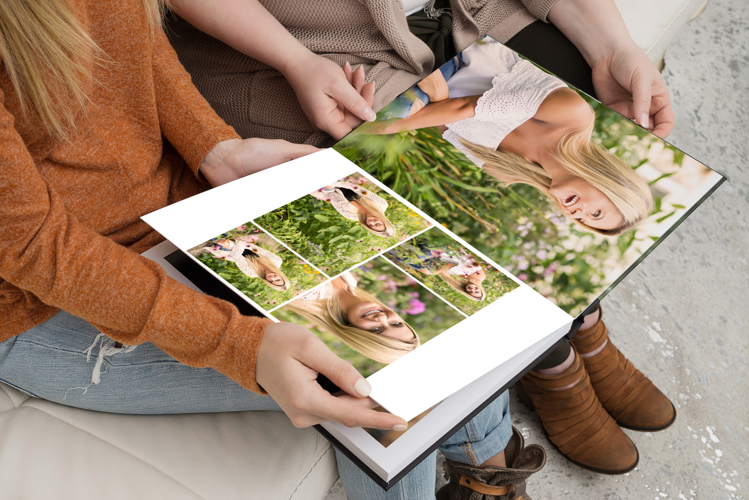 Editorial photograph of a family viewing a handcrafted Luxe Senior Album filled with editorial senior portraits during an in-person image reveal with Jennifer Helmka, Photographer in Massachusetts.